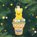 A Sweet PEEPS® Treat. A yellow peep bunny ornament surrounded by different easter eggs inside of a golden waffle cone. View of front