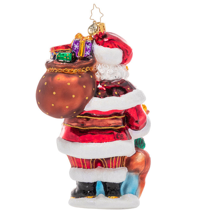 Back - Ornament Description - A Woodland Walk Santa: Walkin' in a Winter Wonderland! Accompanied by an adorable woodland companion, Santa takes a snowy stroll through the tranquil North Pole forests on his way to deliver gifts.