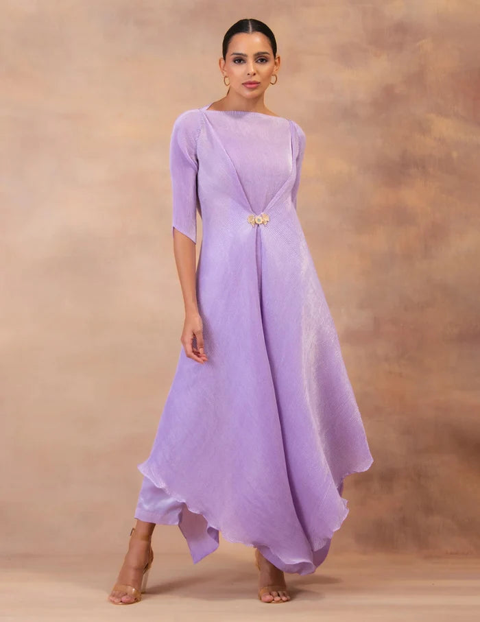 Model wearing the 'AMETHYST FLOW' layered tunic drape-dress set with matching pants, crafted in micro-pleated georgette satin with gold foil detailing.