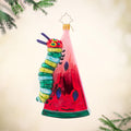 Caterpillar Cravings. Ornament of the hungry caterpillar on a slide of watermelon. View of side
