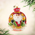 Champagne Dreams Personalized. Ornament of Santa in a red and green suit holding a champaign glass and clock. View of front