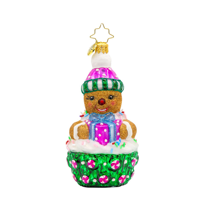 Cookie Cutie ornament. This gingerbread man is perched atop a green and pink cupcake. View of front.