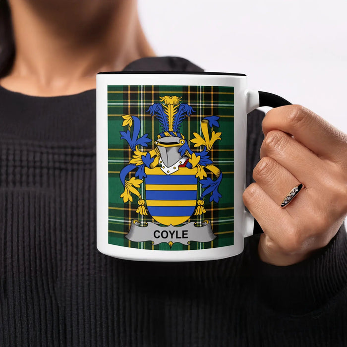 Mug with Coyle family crest on a plaid background.