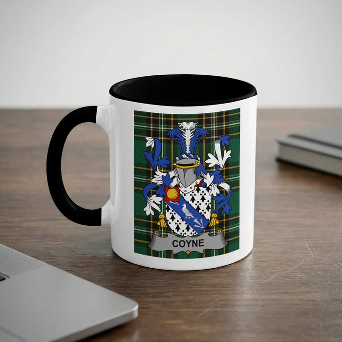 Mug with the COYNE family crest on a checkered background.