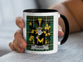 Mug with black rim displaying Croke coat of arms on green tartan background.