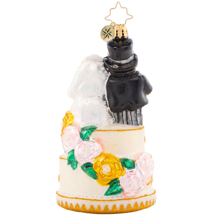 Back - Ornament Description - Dearly Beloved: The perfect bride and groom pair is all dressed up with great flair. This marvelous cake topper is quite the wedding showstopper!