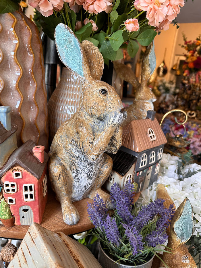 Decorative Rabbit with Paws on Mouth