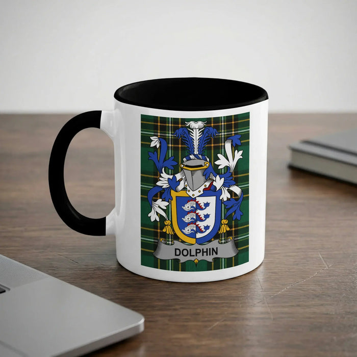 White mug with black handle featuring a blue and green tartan shield with dolphins.