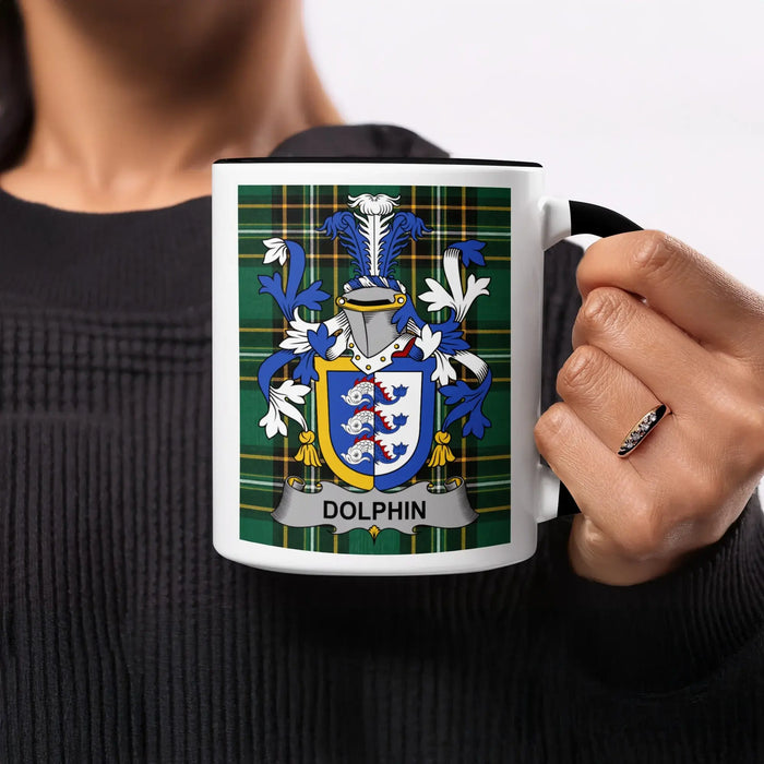 White mug with the Dolphin family crest on a tartan background.