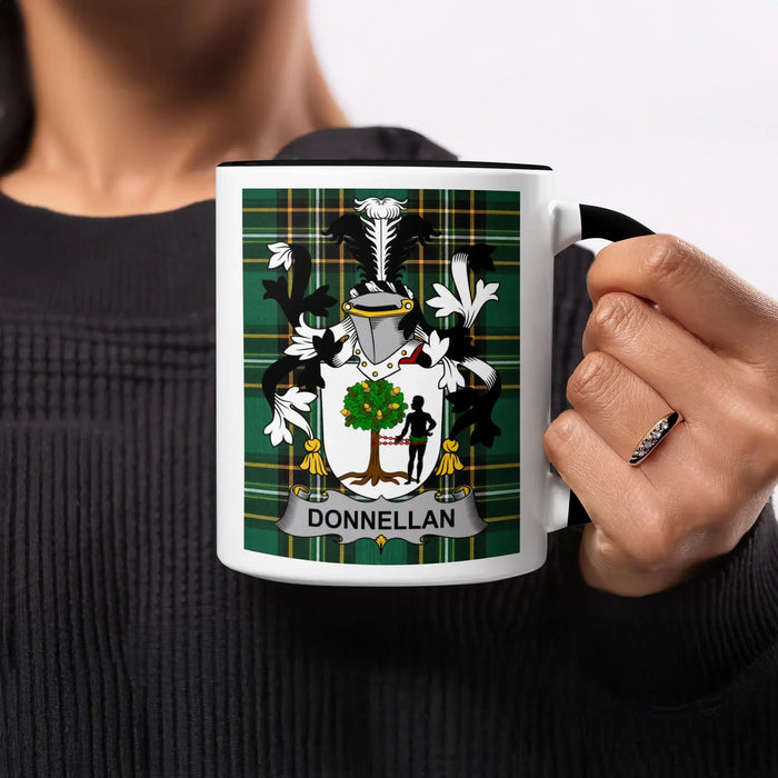 Mug featuring the Donnellan family crest on a green tartan background.