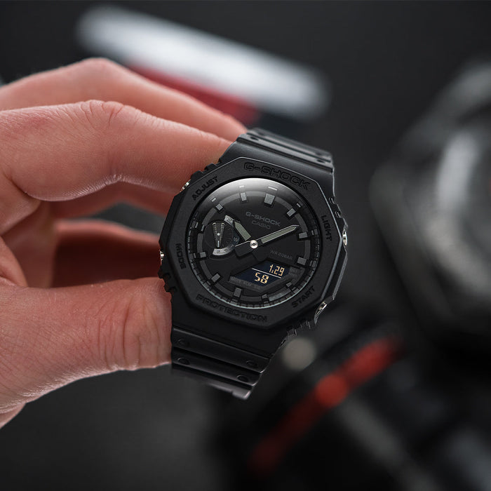 Hand holding a black GA2100-1A1 Casio G-Shock watch