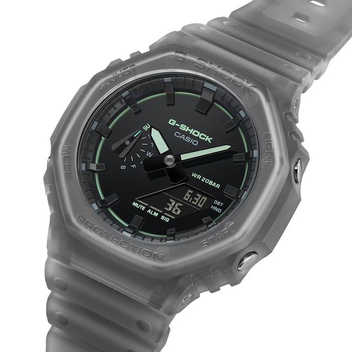Close up of grey GA2100K-1A resin bezel and strap with raised G-SHOCK lettering and partial dial