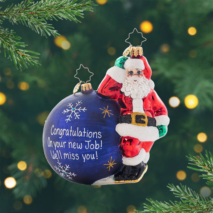 Having A Ball Personalized. Ornament of Santa in his classic red suit leaning next to a giant blue ornament awaiting to be personalized. View of front