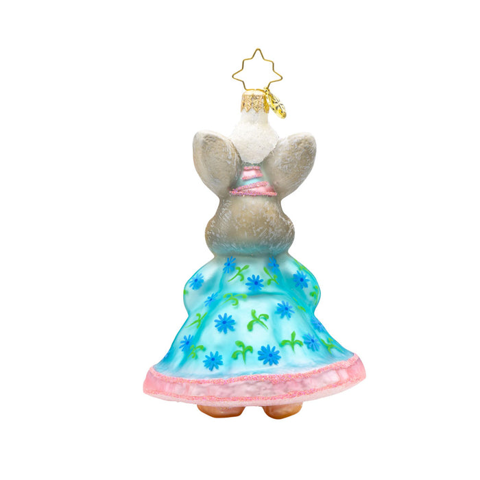 Hoppy Holiday ornament. This bunny is dressed in a blue and pink dress, with a gift in hand. View of back.