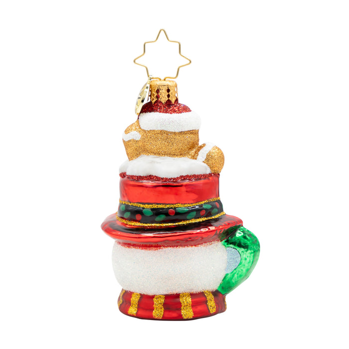 Back of a snowman ornament shaped like a mug with a  gingerbread man sitting on top of the hat design on a white background
