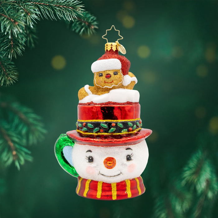 Hot Cocoa Delight ornament. This adorable snowman mug is filled with goodies and a gingerbread friend. View of front.