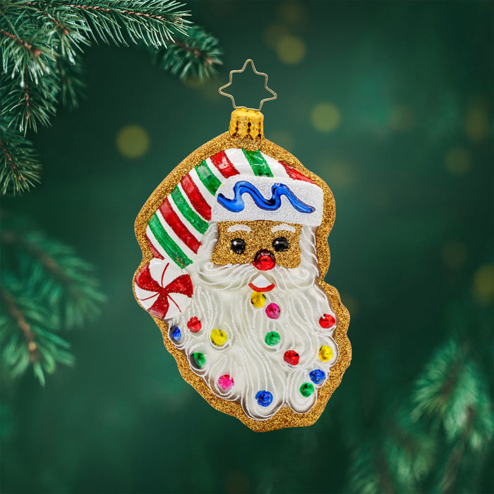 Jolly Gingerbread Santa ornament. A gingerbread cookie of Santa's head. View of front.