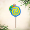 Lollipop Caterpillar. Ornament shaped as a lollipop in colors of blue and yellow with the hungry caterpillar on top. View of front