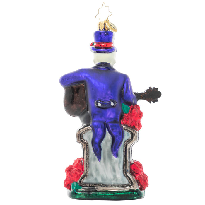 Back - Ornament Description - Love Everlasting: Proof that romance isn't dead…it's undead. A spooky skeleton serenades his beloved beyond with a haunting love song surrounded by blood red roses.