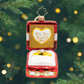 Loves Sparkling Promise Gem. A red, gold, and white ring box ornament with a golden ring in the center and the phrase "Will You Marry Me?" View of front