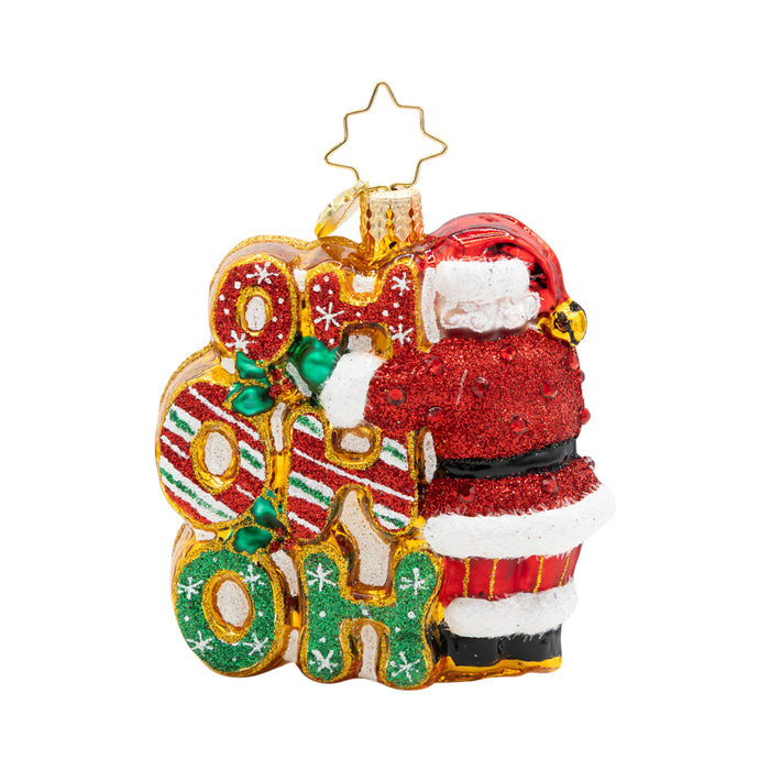 Decorative Christmas ornament with Santa Claus and 'HO HO HO' text reversed on a white background