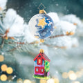 Ornament Description - My Papa Moon: Embody the sweetness and warmth of the World of Eric Carle World this Christmas with Papa's Moon and remember what really matters most this time of year. The celestial moon hangs delicately over the charming cottage home, bringing to mind the innocence and nostalgia of childhood we all yearn for.