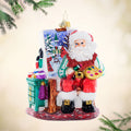 Front image - Pretty as a Picture - (Painting Santa ornament) - Ornament of Santa painting a night scene and surrounded by paints