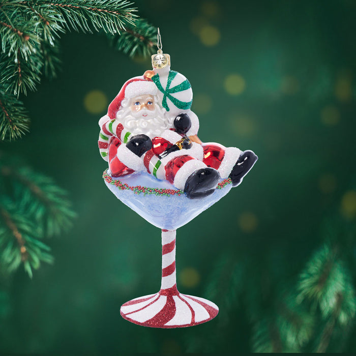 Front image - Santa-Tini - Ornament of Santa in a peppermint martini glass - Ornament of Santa sitting on top of a martini glass with red and white stripes.