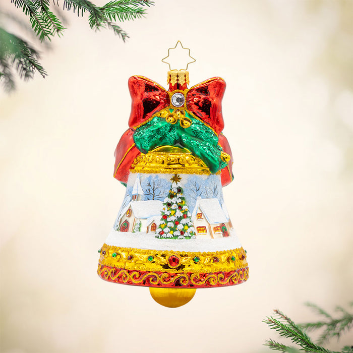 Adorned with a beautiful winter scene, sparkling gems, and a festive ribbon, this Scenic Chimes ornament is the perfect way to add a touch of magic to your Christmas tree. View of front.