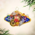 A golden ornament commemorating Las Vegas by featuring casino cards, poker chips, slot machine, and casino roulette. View of front
