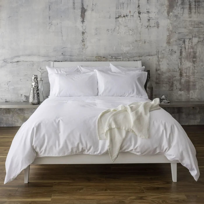 St Genève Sintra 300 thread count percale bedding in crisp white. Available in duvet covers, flat/fitted sheets, shams and pillowcases