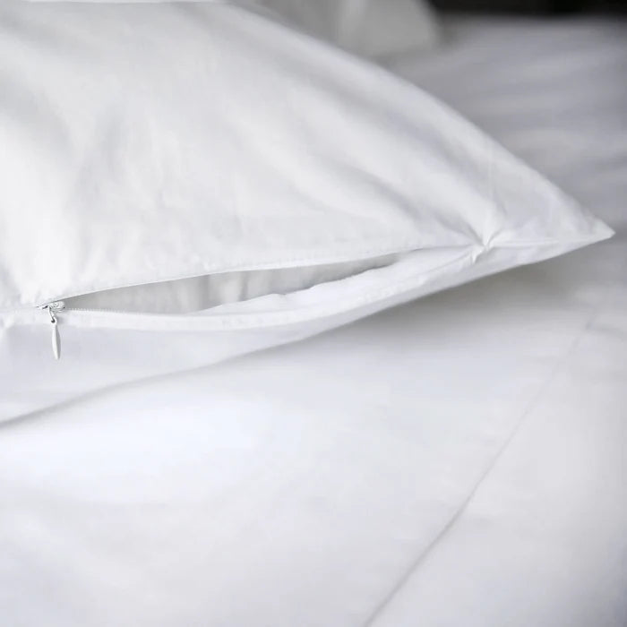 St Genève Sintra 300-thread-count percale bedding in crisp white. Close-up of the sham zippered closure
