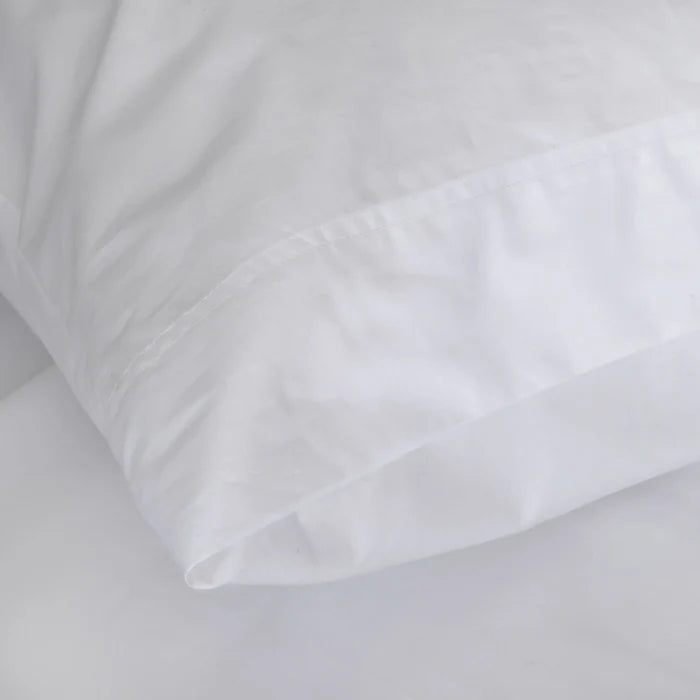 St Genève Sintra 300 thread count percale bedding in crisp white. Available in duvet covers, flat/fitted sheets, shams and pillowcases