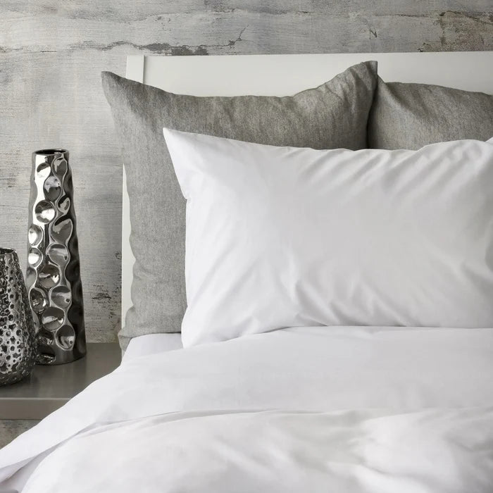 St Genève Sintra 300 thread count percale bedding in crisp white. Available in duvet covers, flat/fitted sheets, shams and pillowcases