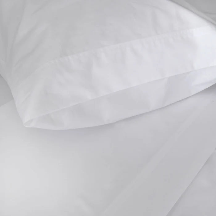 St Genève Sintra 300 thread count percale bedding in crisp white. Available in duvet covers, flat/fitted sheets, shams and pillowcases