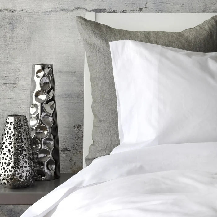 St Genève Sintra 300 thread count percale bedding in crisp white. Available in duvet covers, flat/fitted sheets, shams and pillowcases