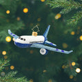 Ornament of a white and blue airplane. View of front