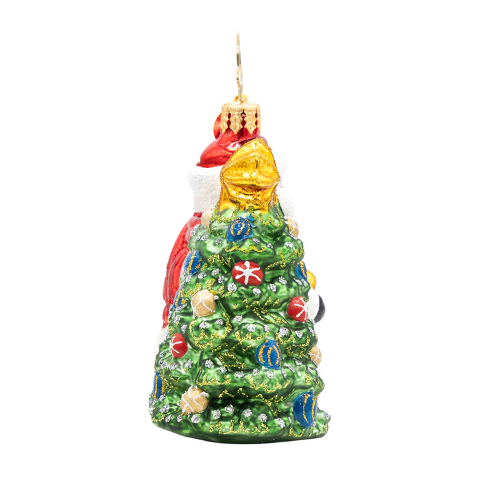Side of the ornament showcasing the  decorated tree. blue, yellow and golden balls with stars etched into each ball on the tree.