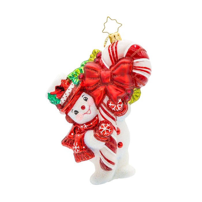 Snowy Retro Cheer ornament. This snowman dressed in festive red attire, holds a candy cane wrapped in red ribbon as big as himself. View of front.