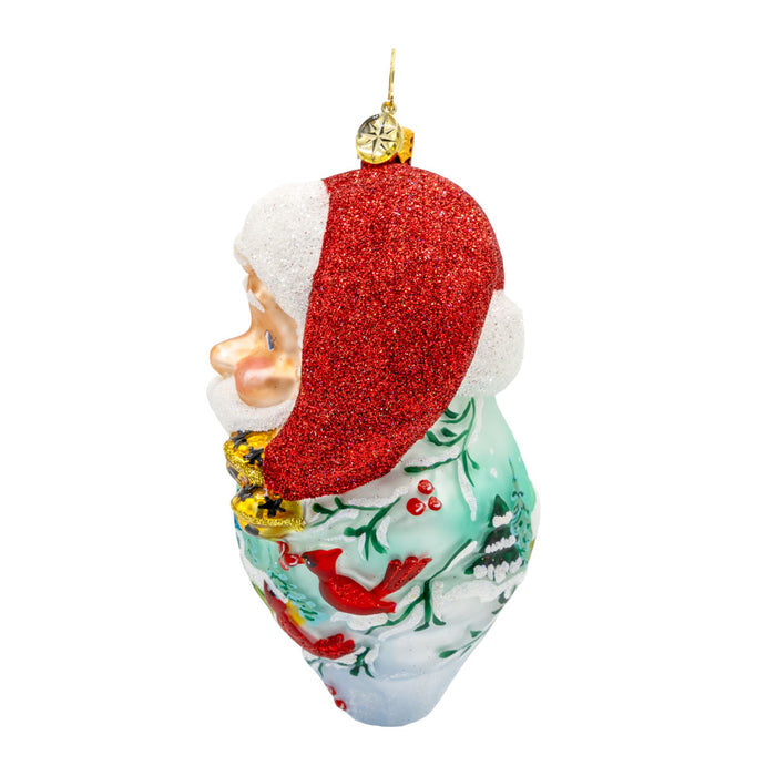 St Nick's Winter Tale ornament. Santa's smiling face and snowy scene with intricate details and a hand-painted beard. View of right side.