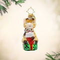 Stacked with Sweetness Gem ornament. A giraffe sits atop a gift with a stocking full of candy canes in hand. View of front.