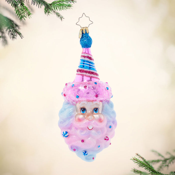 Front image - Sugar Spun Santa - (Santa ornament) - Ornament of Santas face with a pink hat adorned with blue and an ombre bard