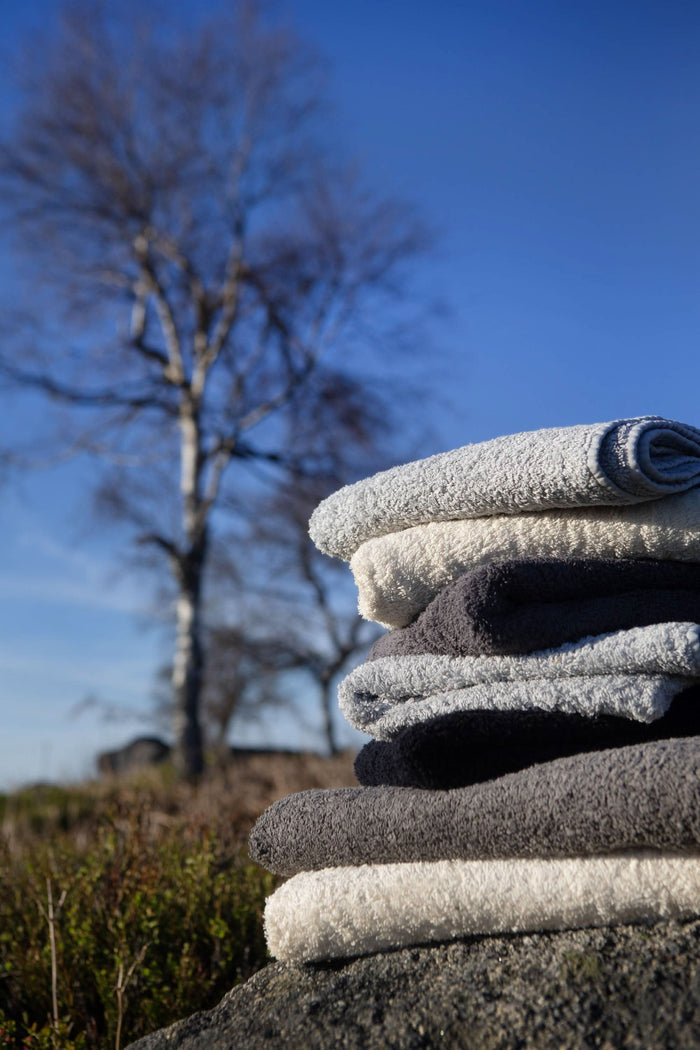 A&H Super Pile Towels (top-to-bottom) in 950 Cloud, 101 Ecru, 992 Platinum, 990 Black, 920 Gris and 101 Ecru