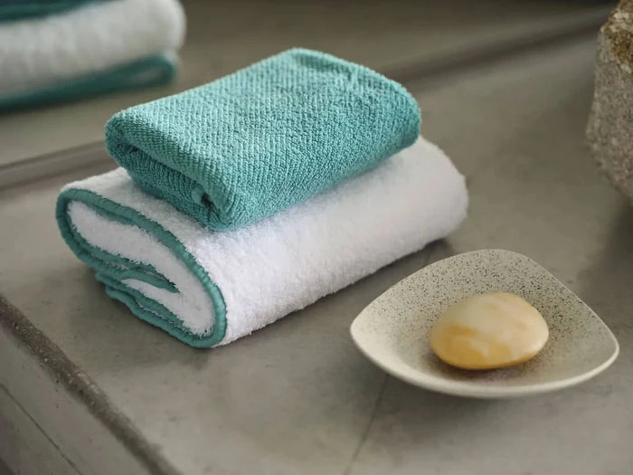 A&H Twill Fingertip Towel in 302 Lagoon (top). Bottom: A&H Surf Hand Towel in 302 Lagoon (100 White Super Pile base)