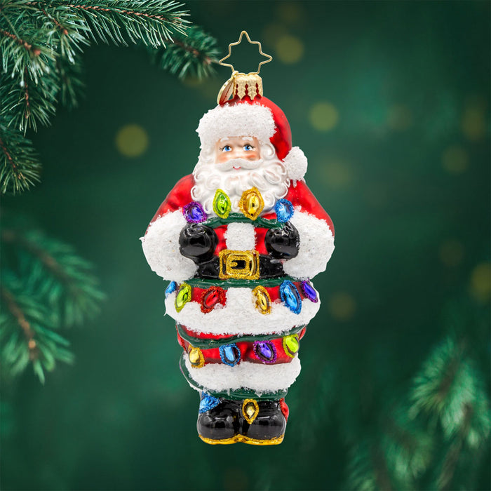 Tangled Up Santa ornament. This Santa's caught in a colorful mess of Christmas lights. View of front.