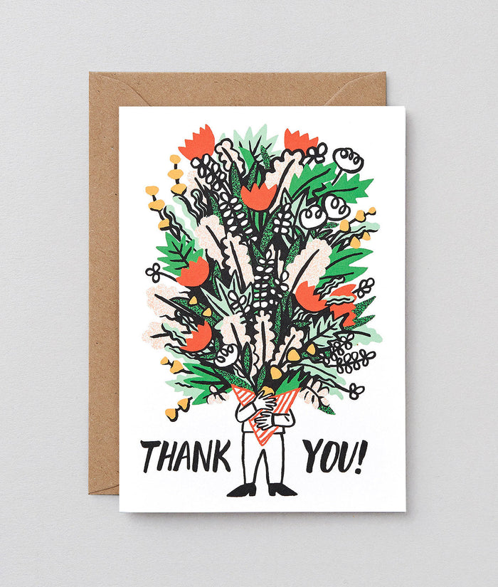 a thank you card which shows a person holding a huge bunch of flowers