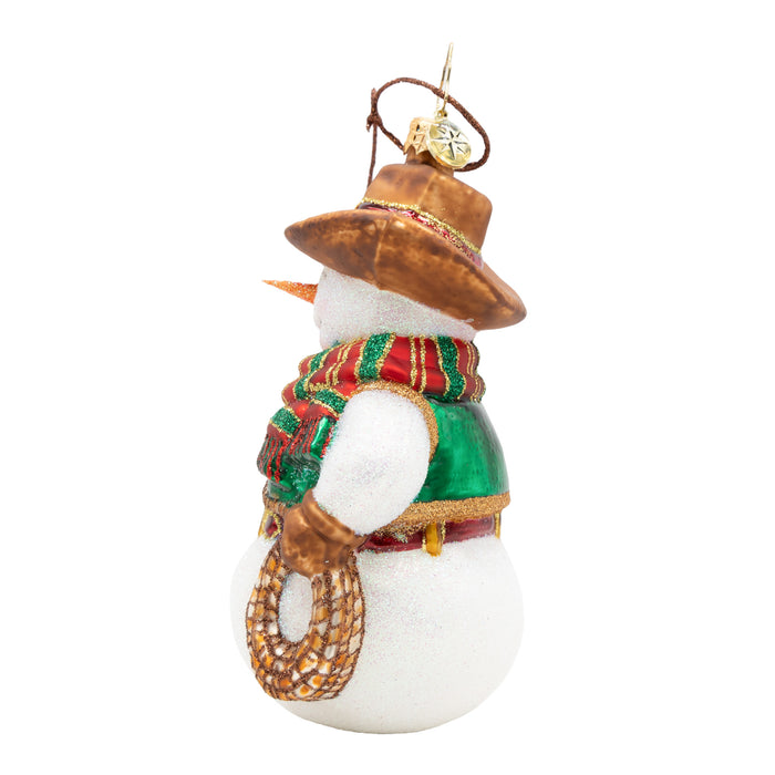 Side view of a snowman ornament with cowboy hat, red, gold and green striped scarf, and lasso. Showcases the side of the lasso. Placed on a white background.