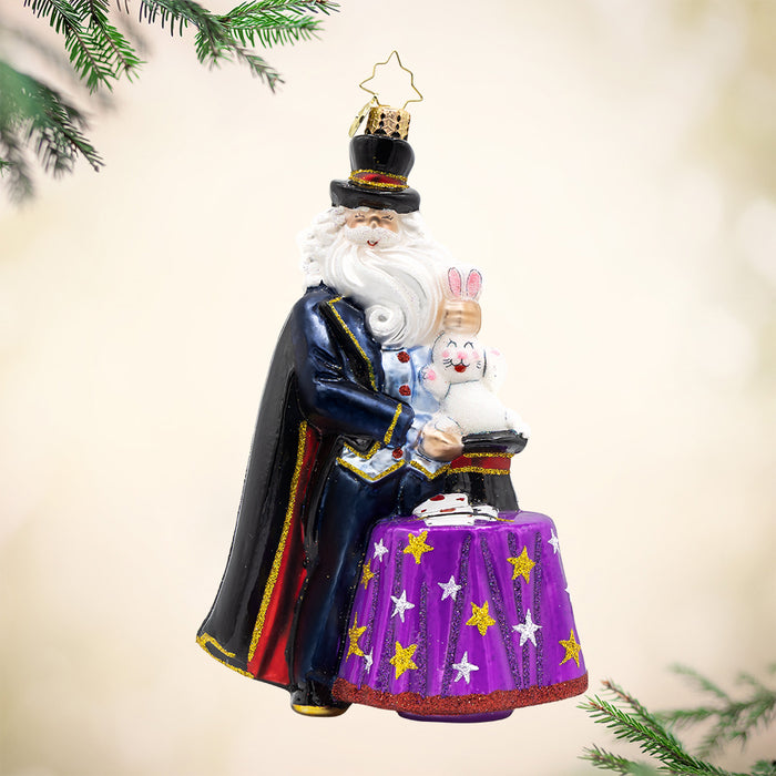 Magician Santa is ready to amaze and delight you with his sparkling black cape and hat, fluffy white beard, and a rabbit up his sleeve, and he'll be sure to bring magic to your Christmas tree.