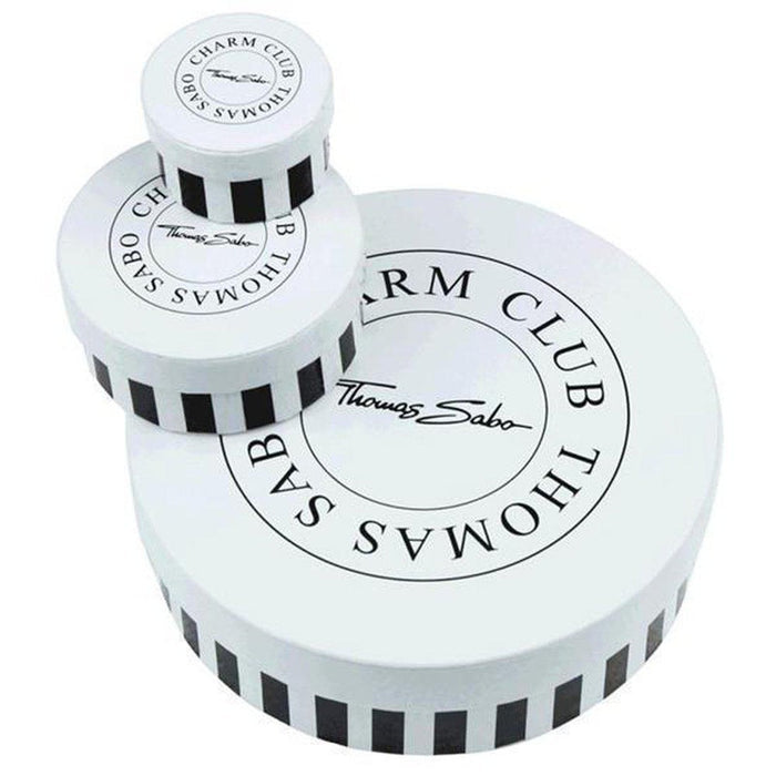 White cylindrical gift boxes with black stripes and logo.