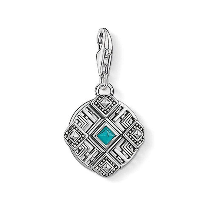 Charm 1421 Africa Ornament: Silver charm with turquoise stone, intricate geometric design.